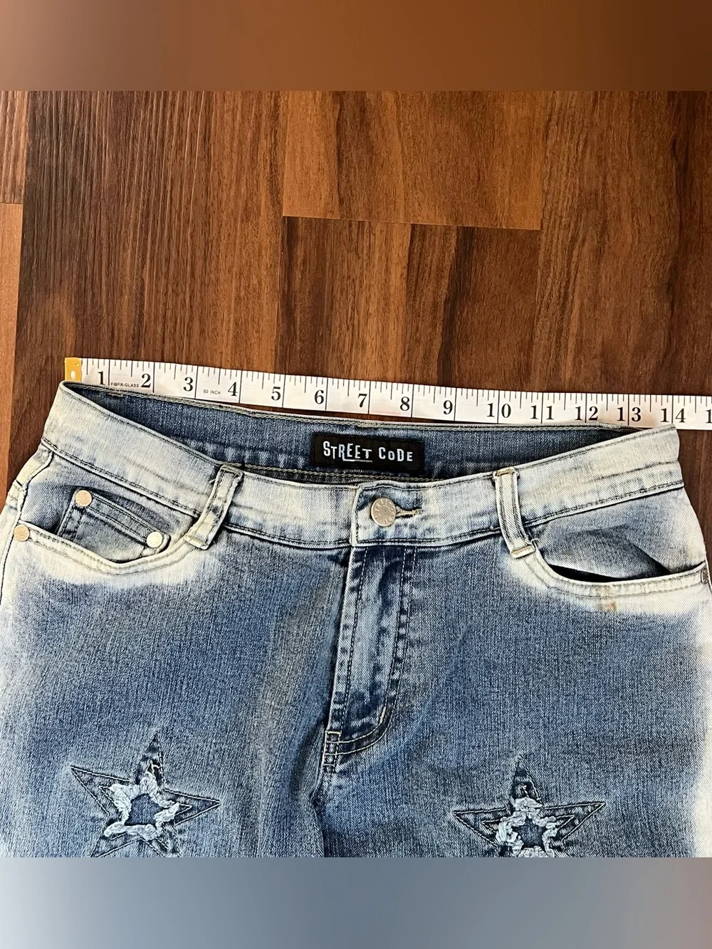 Vintage Y2K Street Code jeans with distressed star patch details